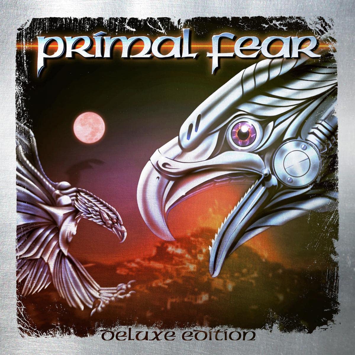 "Album cover with silver eagle head and wing, full moon, and 'deluxe edition' text."