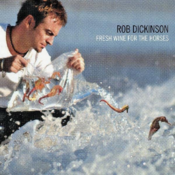 Album cover: man with seahorses in splashing water, blue background.