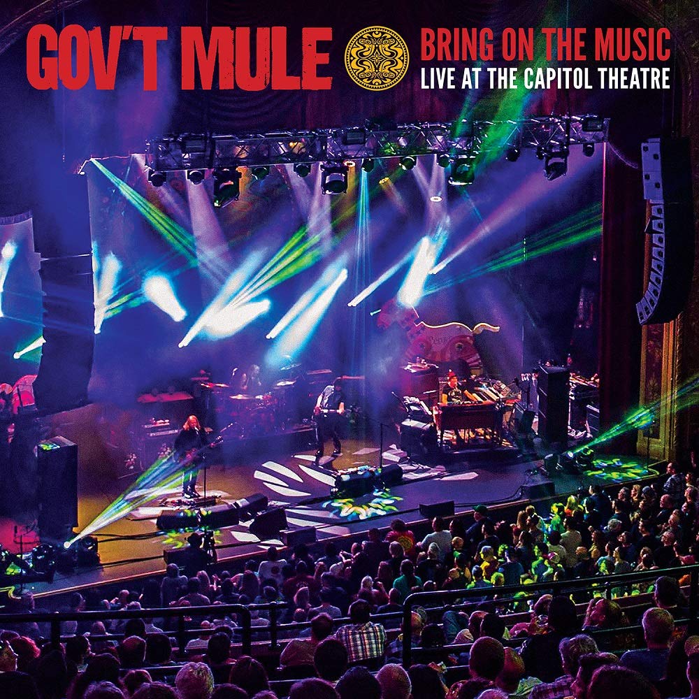 "CD cover featuring a live concert with Gov't Mule band on stage with audience."