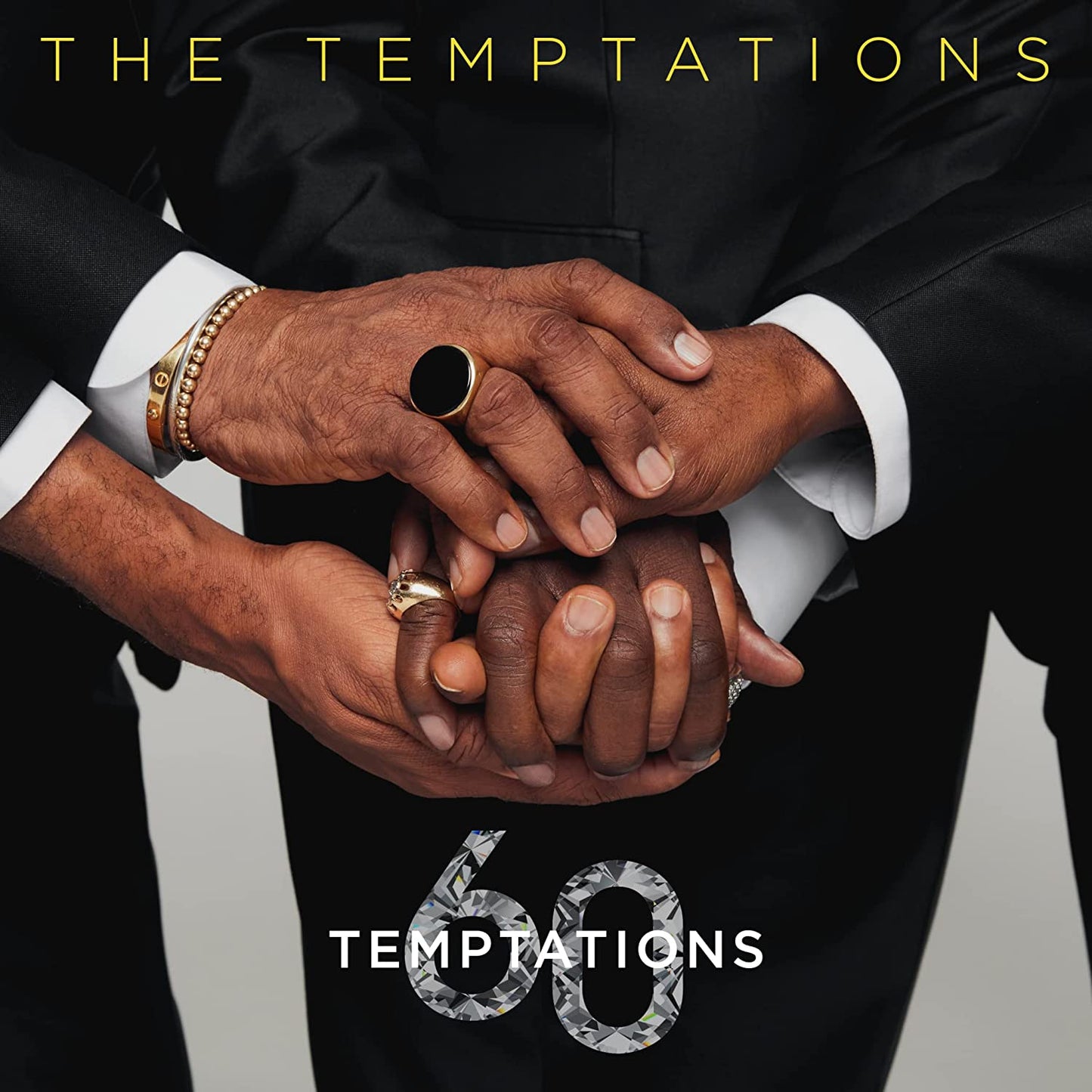 CD cover for The Temptations’ “Temptations 60” featuring clasped hands.