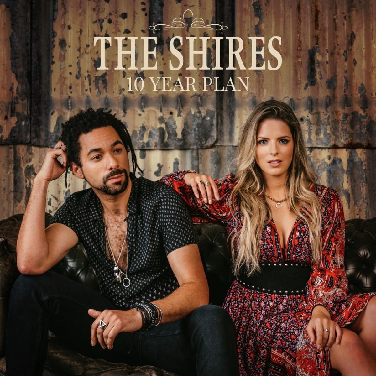 The image depicts a CD cover featuring a man with blonde hair and blue eyes.