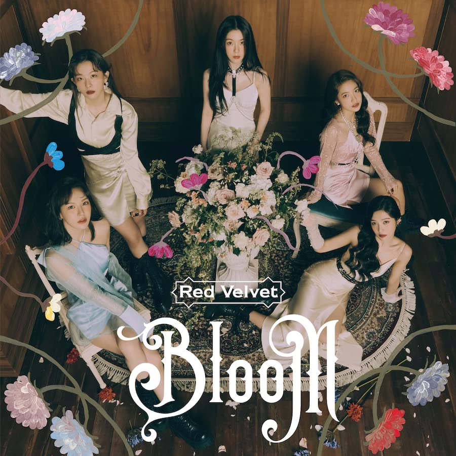 Red Velvet album cover, "Bloom," featuring five women surrounded by flowers.