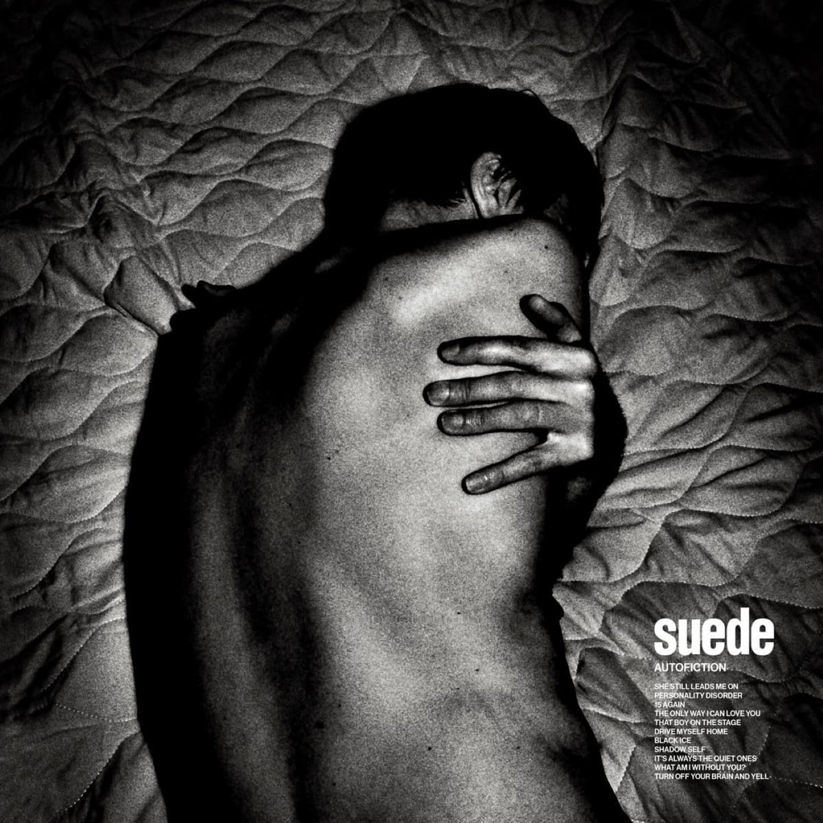 Black and white album cover featuring a person with their back to the camera.