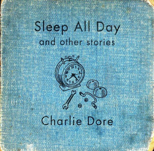 Blue CD cover with alarm clock illustration and "Charlie Dore" text.