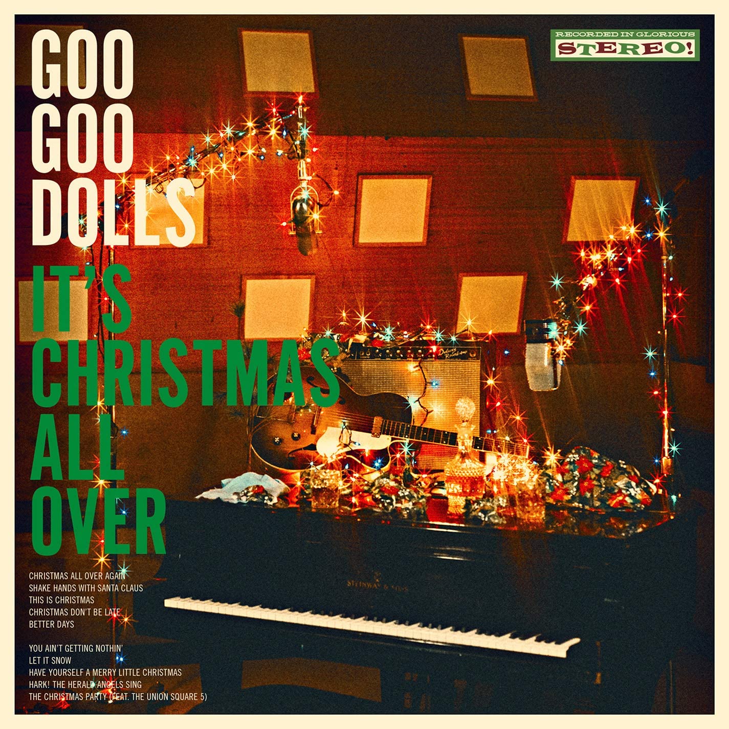 "Goo Goo Dolls Christmas album cover with piano, guitars, and Christmas lights."