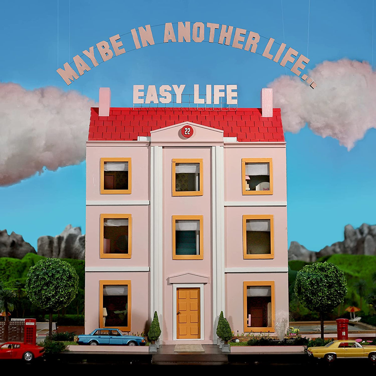 Album cover for Easy Life’s “Maybe In Another Life” featuring a pink dollhouse.
