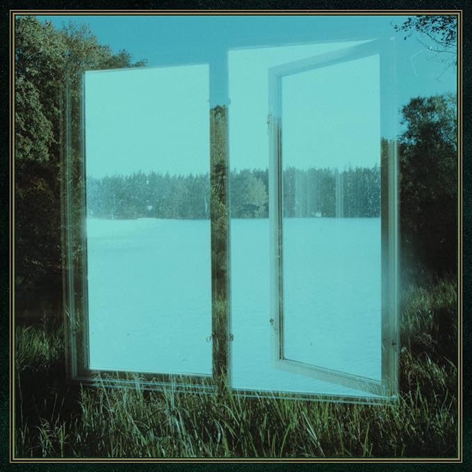 Open window frame revealing a landscape of trees and water.