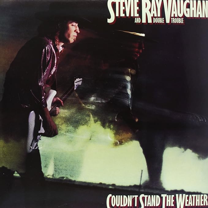 Stevie Ray Vaughan album cover, musician playing guitar onstage.