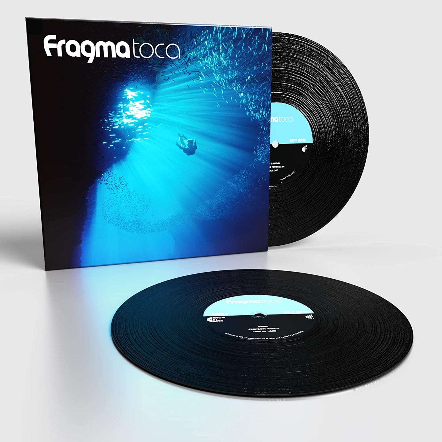 "Album cover featuring a diver surrounded by fish underwater with sunlight shining down."