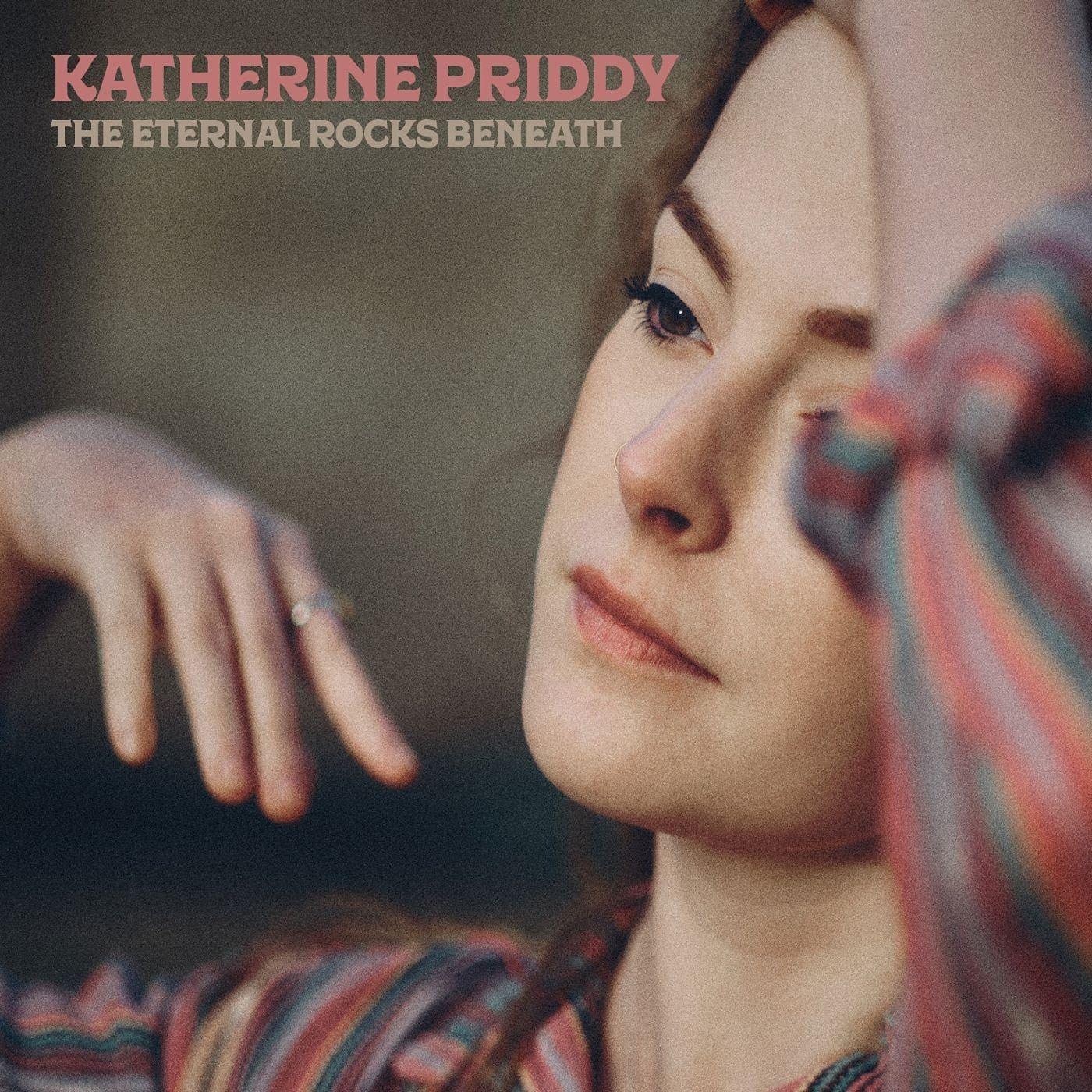 Album cover featuring a close-up of a woman's face with striped fabric.