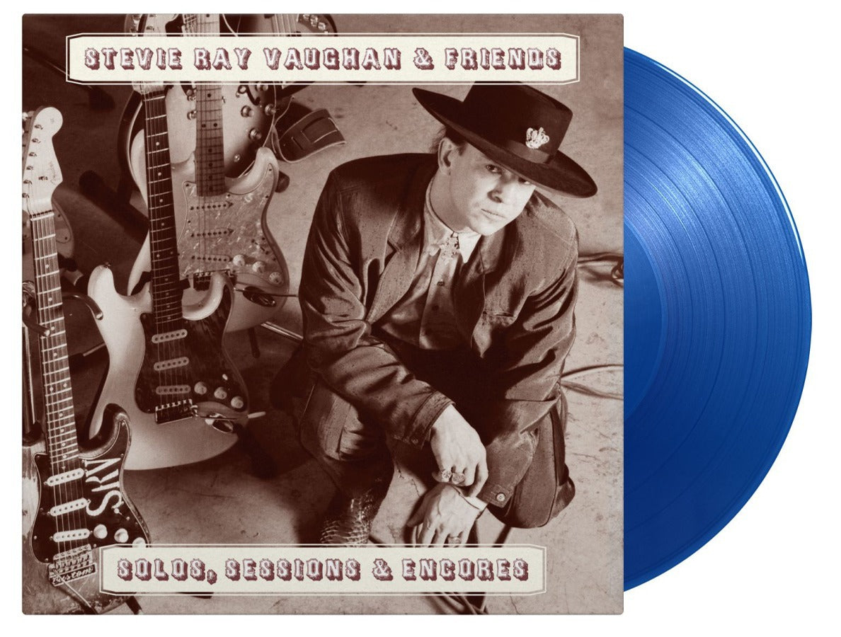 Stevie Ray Vaughan album cover with guitars and a blue vinyl record.