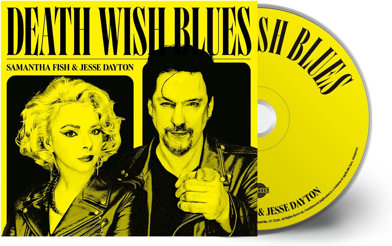 "CD case and disc with yellow cover art featuring a man and woman."