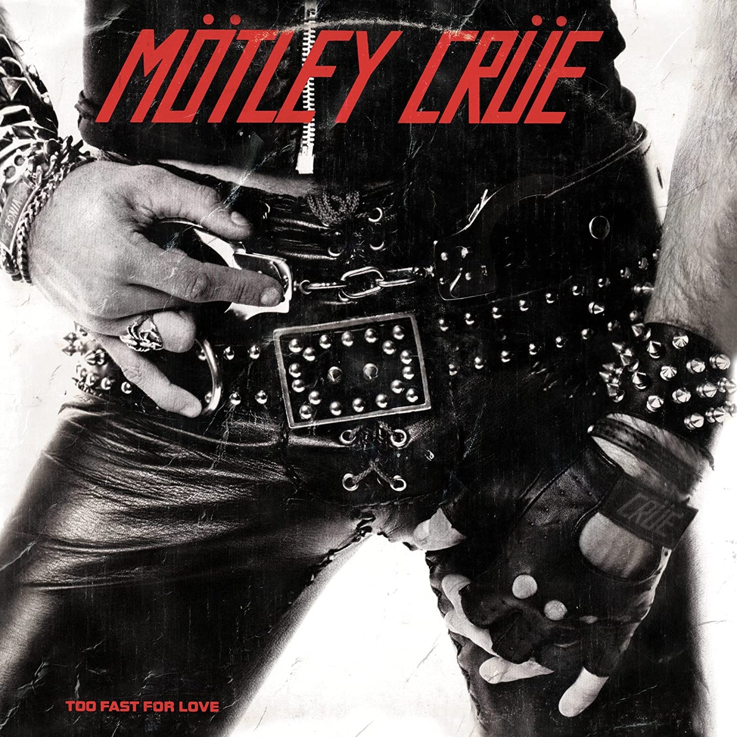 "Black and white album cover with a person wearing studded leather clothing and red text."
