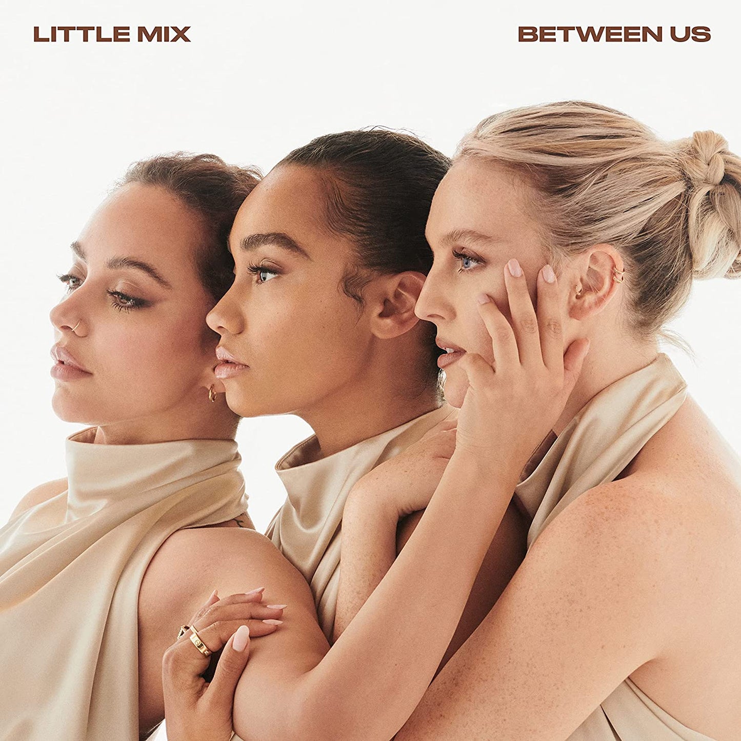 Little Mix album cover, “Between Us”, featuring three women in profile.