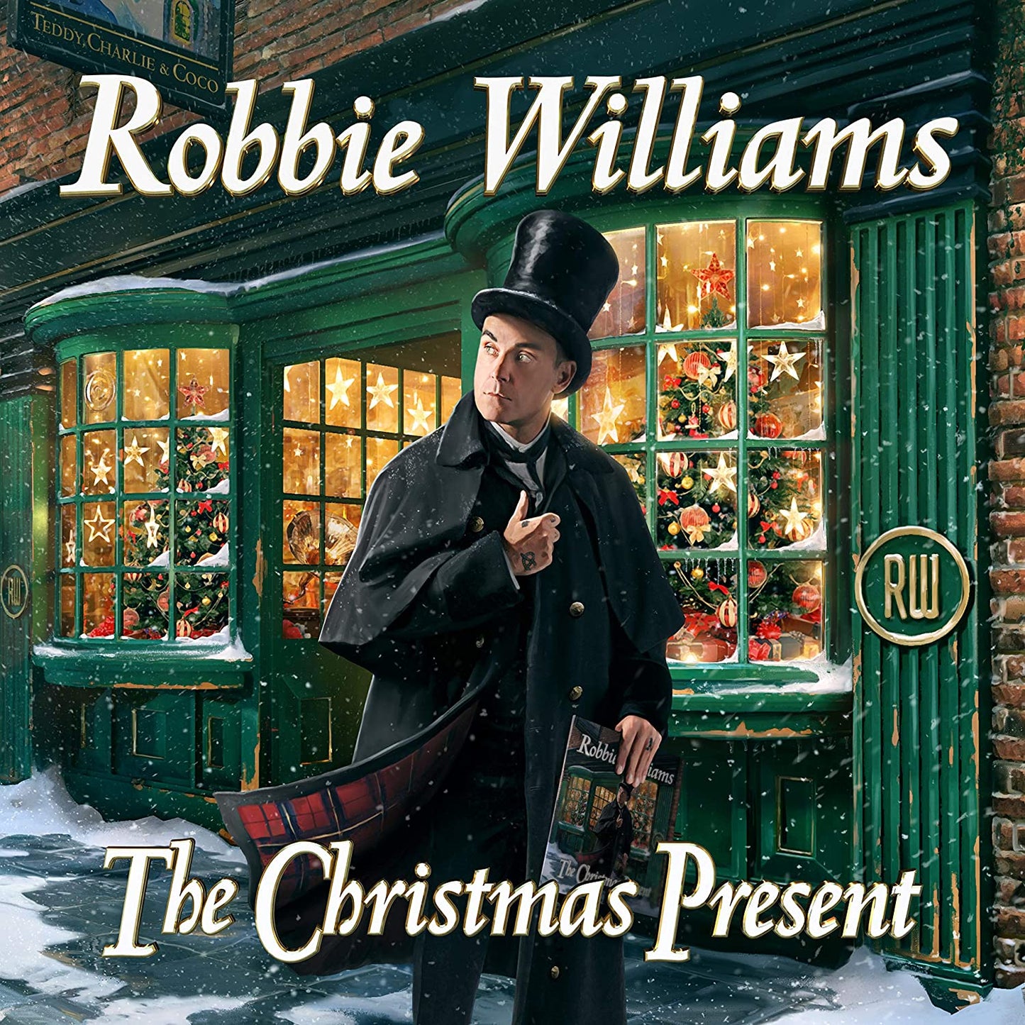 "Album cover featuring Robbie Williams in a top hat outside a festive shop window."