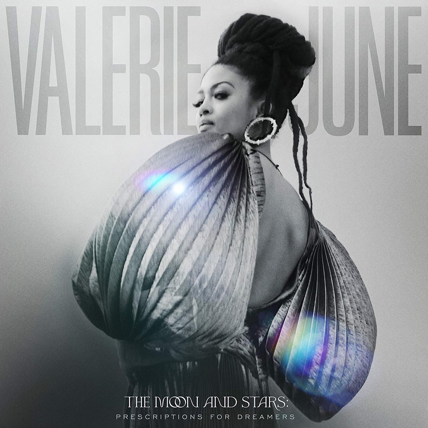 Black and white album cover featuring Valerie June with a large, draped fabric.
