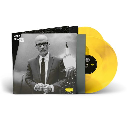 "Yellow vinyl record with black label and album cover featuring a man in a suit."