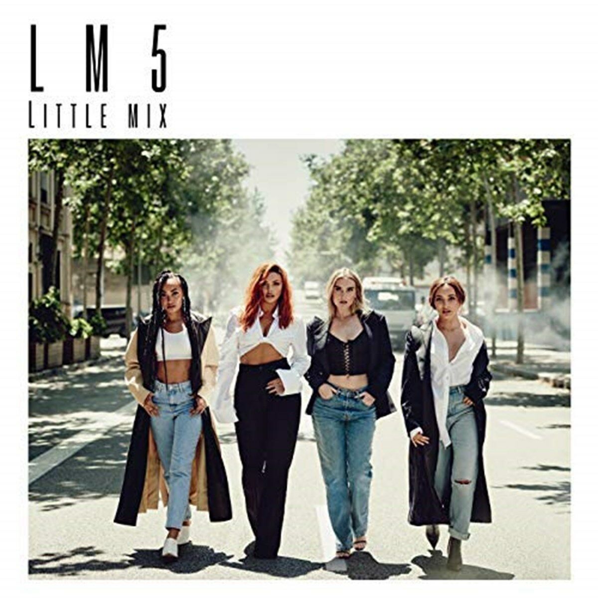 "Album cover featuring four women walking down a street, wearing casual clothing."
