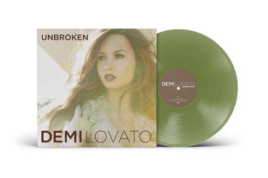 Demi Lovato’s “Unbroken” green vinyl LP record and album cover displayed.