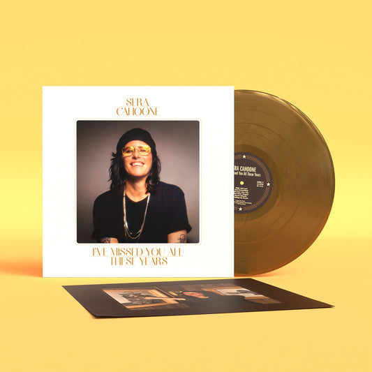Sera Cahoone vinyl record, sleeve, and inner sleeve on a yellow background.