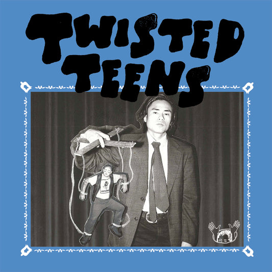 Album cover: man in suit with a doll, blue and orange border.