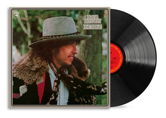 Bob Dylan's "Desire" vinyl record cover with a portrait and black disc.