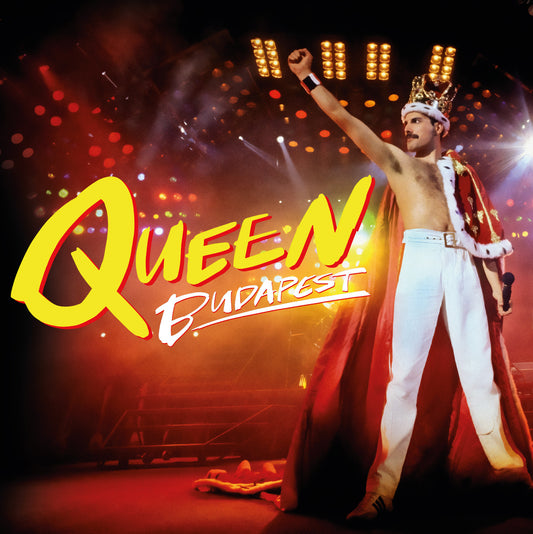 Freddie Mercury performing onstage with the band Queen, concert footage.