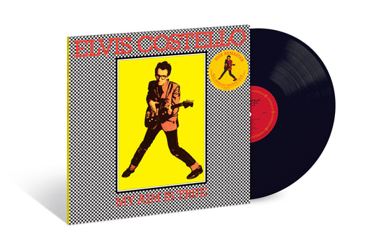 Elvis Costello album cover and black vinyl record, checkered background.