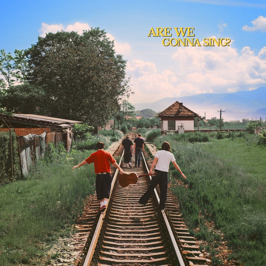 Album cover: four figures walking on railroad tracks toward distant mountains.