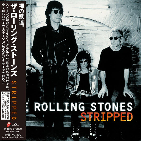 The Rolling Stones “Stripped” CD cover with band members in black and white.