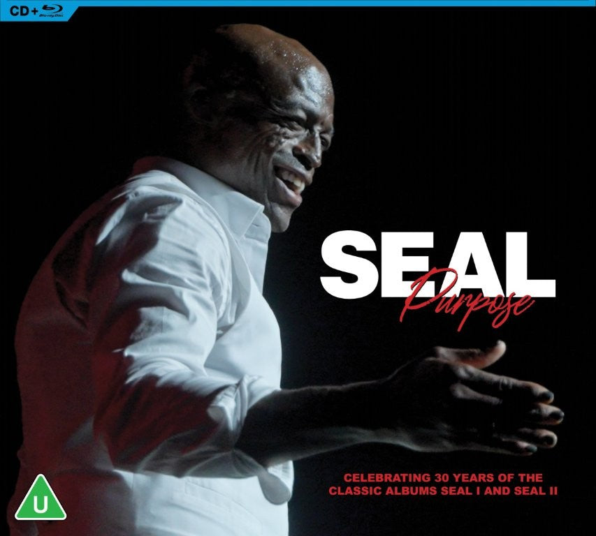 Seal smiling in a white shirt against a black background with album text overlay.