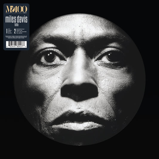 Miles Davis “Tutu” vinyl record with a black and white portrait.