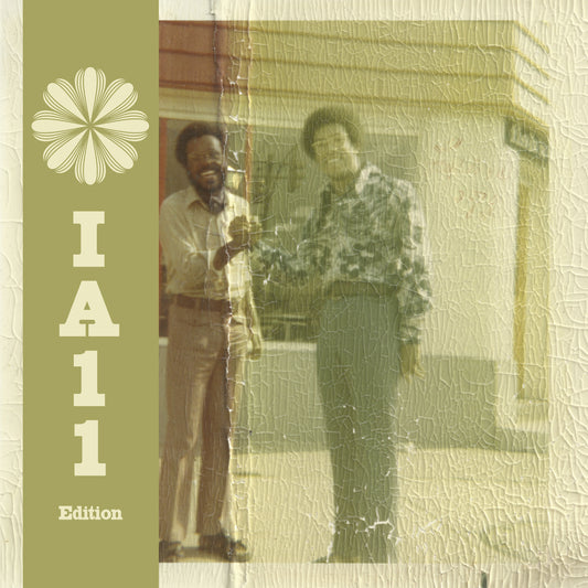 Vintage photo of two men shaking hands with a green sidebar featuring a flower.