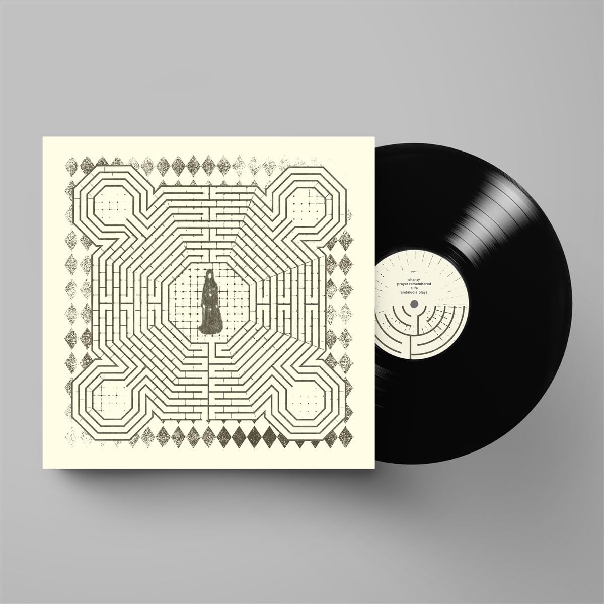 Slowdive vinyl record with intricate geometric design on white background.