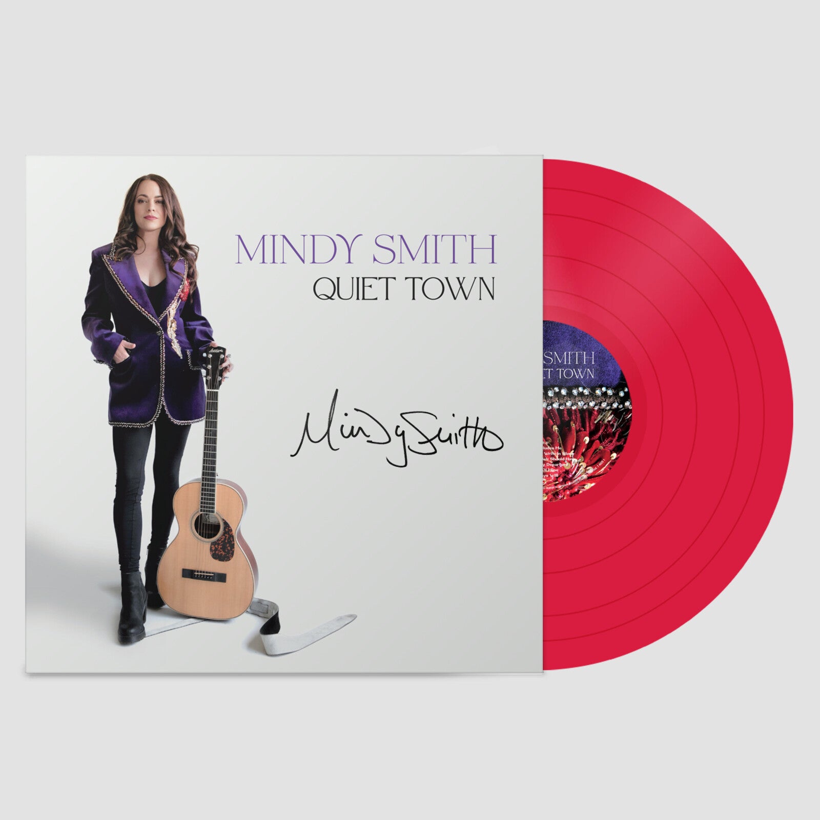Mindy Smith's "Quiet Town" vinyl record with a portrait and red disc.