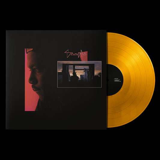 Sampha’s “Dual” vinyl record with orange disc and portrait cover.