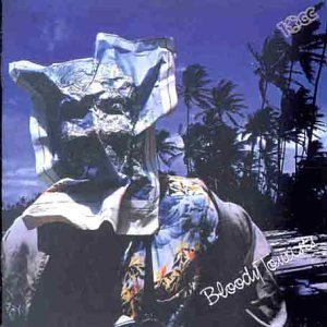 Album cover for 10cc’s “Bloody Tourists” featuring a distorted face and palms.