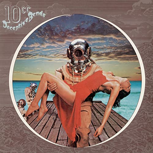 A deep-sea diver in a vintage suit carries a woman in a red dress.