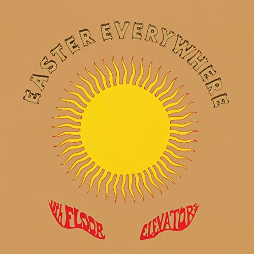 Vinyl album cover with a yellow sun, arched text, and red band name below.