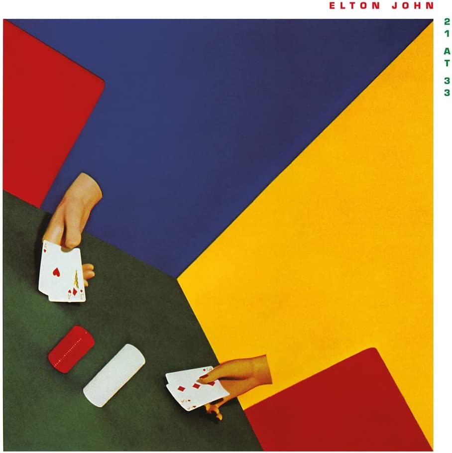 Album cover for Elton John’s “21 at 33” with hands holding playing cards.