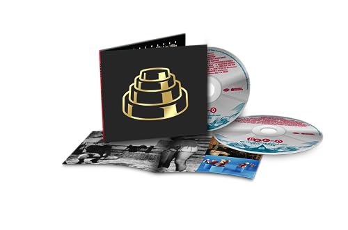 Devo CD package with black cover, gold energy dome, and booklet.