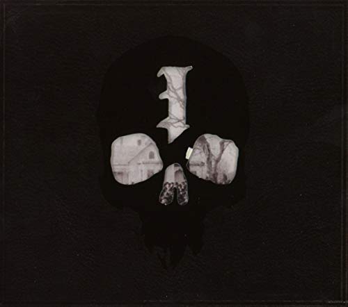 Black skull-shaped CD cover with fragmented, textured imagery and a number one.