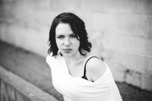 Black and white portrait of a woman with short dark hair.
