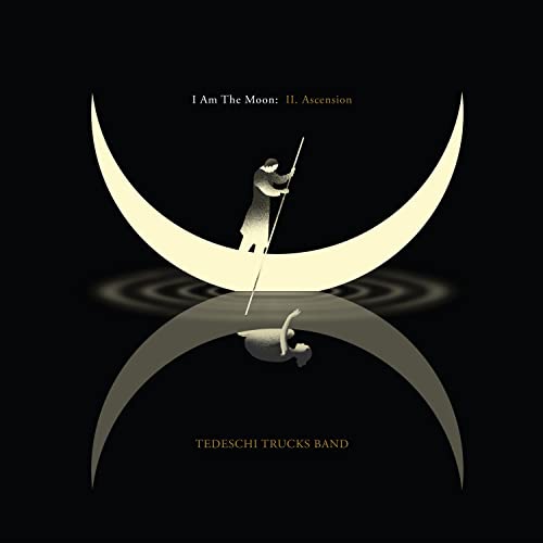 Tedeschi Trucks Band album cover: figure on a crescent moon, reflection below.