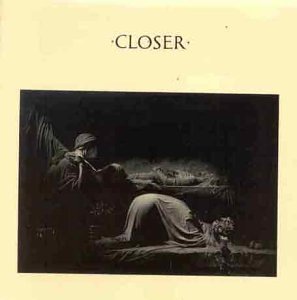 Joy Division’s “Closer” album cover: a dark, shadowy figure and landscape.