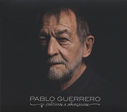 Close-up portrait of Pablo Guerrero, a man with gray hair and beard.