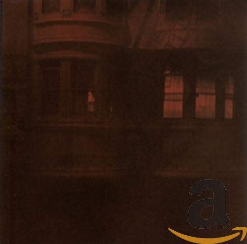 The alt text for the image is: "Dark brown CD case cover with Amazon logo in the corner."