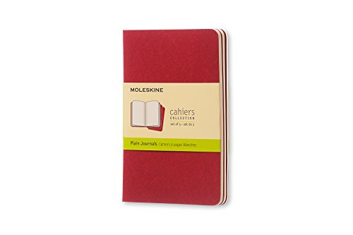 Three red Moleskine cahier notebooks with a yellow label.