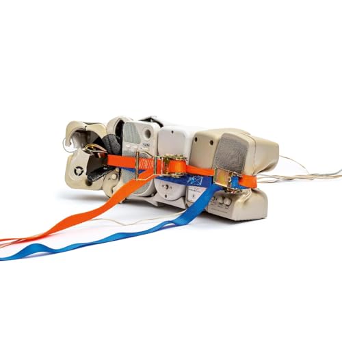 Damaged Blu-ray player secured with orange and blue straps.
