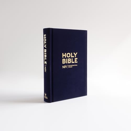 A navy blue velvet Holy Bible with gold embossed text on a white background.